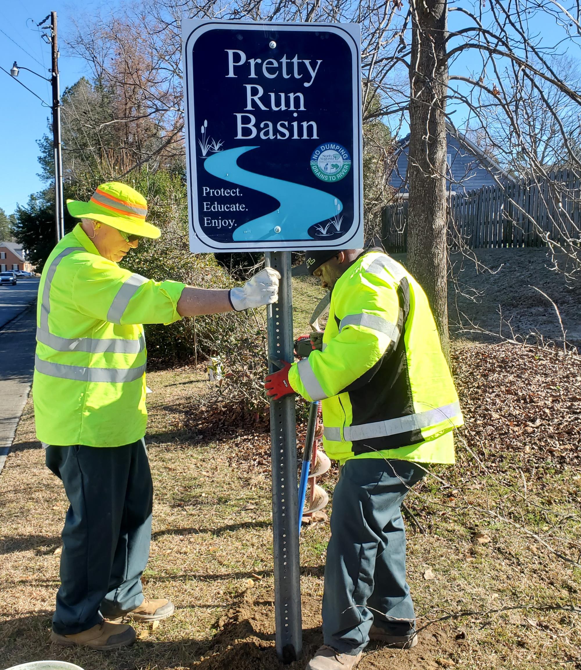 stormwater, basin sign, installing, Lamar Harvey, Bill Fokes