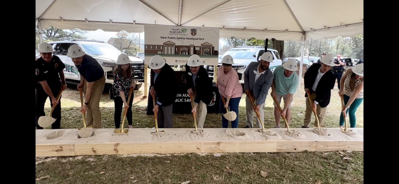 people with shovels at a groundbreaking ceremony